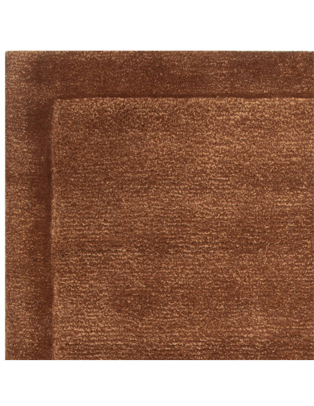 Elevate your space with the Rise Rust minimalist rug, featuring warm tones and durable wool-viscose blend for style and comfort