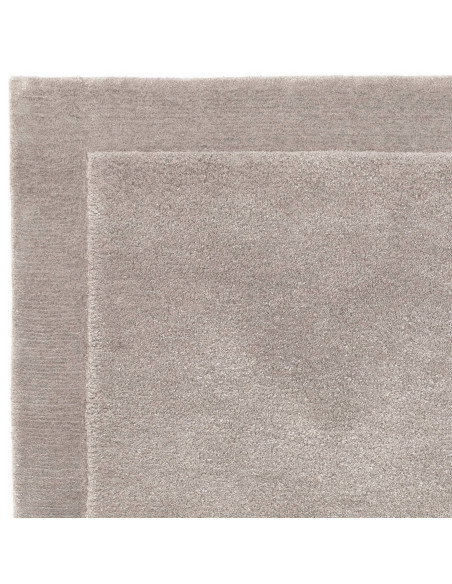 Elevate your space with the Rise Silver rug, a luxurious, handmade minimalist rug in soft silver-gray—perfect for modern, neutr