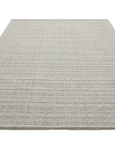 Elevate your space with the Thatch Greige rug, a handcrafted minimalist rug featuring a soft neutral tone and elegant geometric