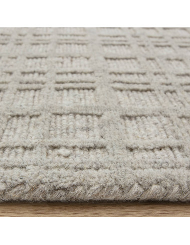 Elevate your space with the Thatch Greige rug, a handcrafted minimalist rug featuring a soft neutral tone and elegant geometric