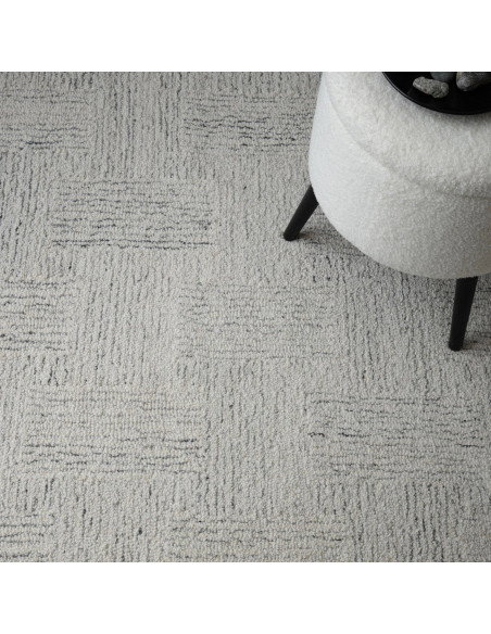 Elevate your space with the Theodore Chevron Sand rug—a hand-tufted, natural wool blend perfect for minimalist rugs lovers seek