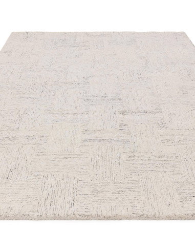Elevate your space with the Theodore Chevron Sand rug—a hand-tufted, natural wool blend perfect for minimalist rugs lovers seek