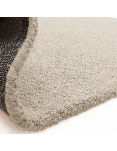Handcrafted minimalist rug in neutral tones, offering plush comfort and durable natural fibers—perfect for elevating any modern