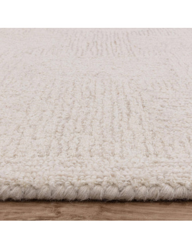 Elevate your space with the Theodore Hatch White & Sand rug, a minimalist rug featuring hand-tufted texture and timeless neutra