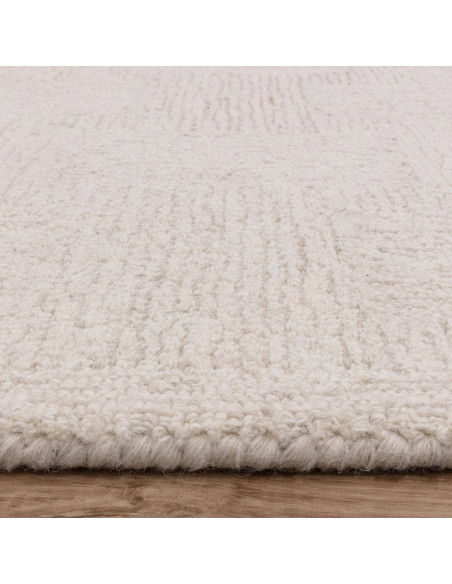 Elevate your space with the Theodore Hatch White & Sand rug, a minimalist rug featuring hand-tufted texture and timeless neutra