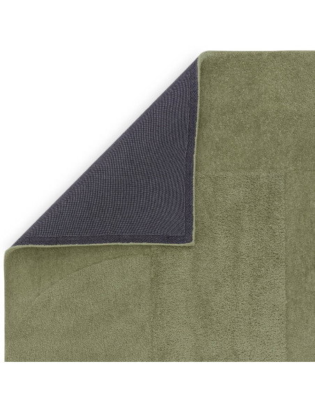 Soft and durable Tova Green minimalist rug with subtle patterns, perfect for adding modern elegance and calm to any living spac