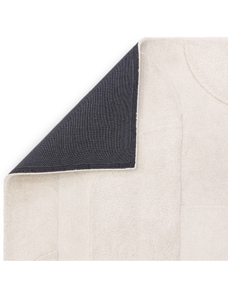 Elevate your space with the Tova Ivory rug, a durable and stylish minimalist rug featuring a soft neutral tone and subtle geome