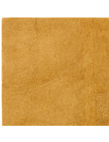 Add warmth and subtle texture to your space with the Tova Ochre minimalist rug, perfect for modern interiors seeking cozy, dura