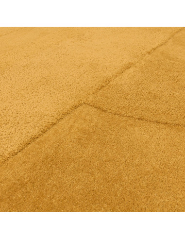 Add warmth and subtle texture to your space with the Tova Ochre minimalist rug, perfect for modern interiors seeking cozy, dura