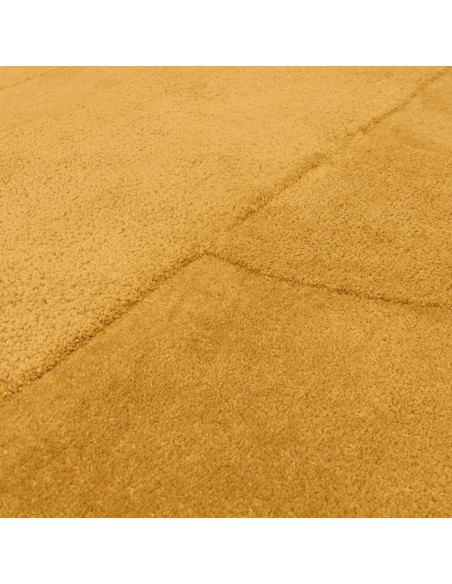 Add warmth and subtle texture to your space with the Tova Ochre minimalist rug, perfect for modern interiors seeking cozy, dura