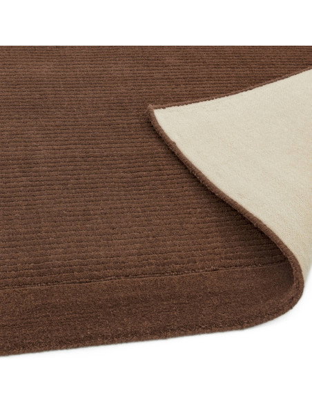Elevate your space with the York Chocolate rug, a minimalist rug featuring a warm chocolate tone and elegant geometric border f
