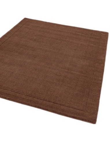 Elevate your space with the York Chocolate rug, a minimalist rug featuring a warm chocolate tone and elegant geometric border f
