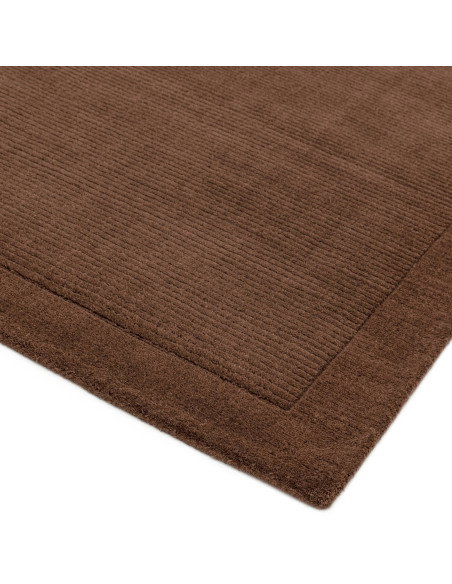 Elevate your space with the York Chocolate rug, a minimalist rug featuring a warm chocolate tone and elegant geometric border f