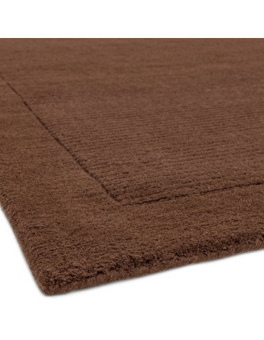 Elevate your space with the York Chocolate rug, a minimalist rug featuring a warm chocolate tone and elegant geometric border f