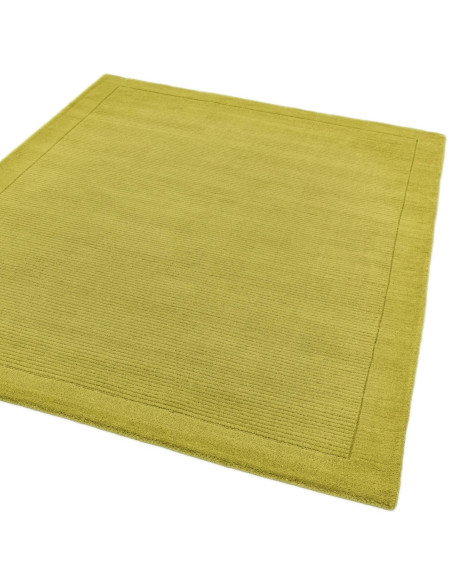 Tappeto minimal York Green in lana naturale verde oliva, design a cornice, morbido e resistente, perfetto per ambienti moderni