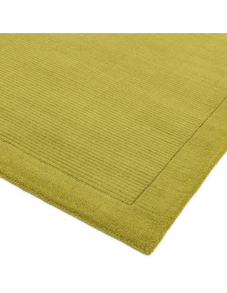 Tappeto minimal York Green in lana naturale verde oliva, design a cornice, morbido e resistente, perfetto per ambienti moderni