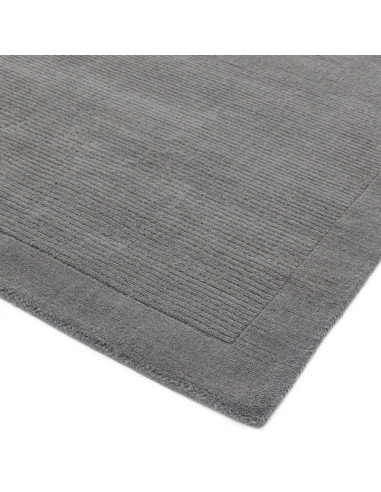 Elevate your space with the York Grey rug, a minimalist rug featuring a geometric border and soft, durable 100% wool for timele