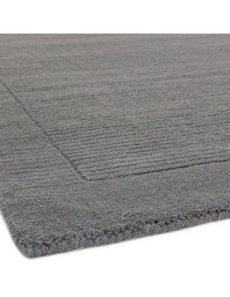 Elevate your space with the York Grey rug, a minimalist rug featuring a geometric border and soft, durable 100% wool for timele