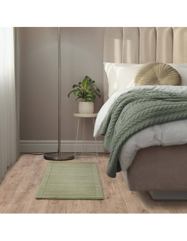 Elegant York Sage rug with a subtle geometric border, crafted from soft wool—perfect for adding calm style to any minimalist or