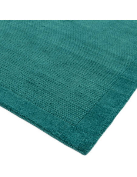 Elevate your space with the York Teal rug—an elegant minimalist rug featuring a calming teal shade and soft, durable 100% wool