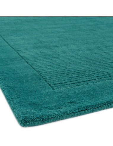 Elevate your space with the York Teal rug—an elegant minimalist rug featuring a calming teal shade and soft, durable 100% wool