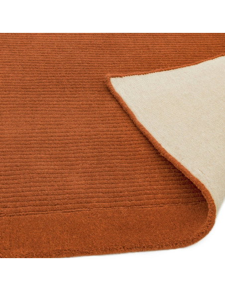 Elevate your space with the York Terracotta rug, a minimalist rug crafted from natural wool featuring an elegant geometric desi