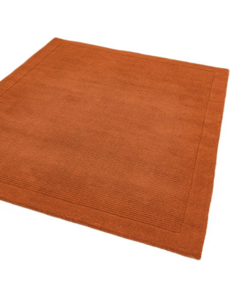 Elevate your space with the York Terracotta rug, a minimalist rug crafted from natural wool featuring an elegant geometric desi