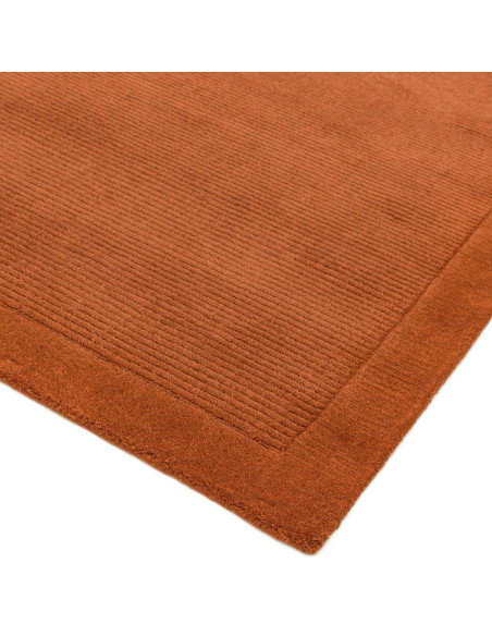 Elevate your space with the York Terracotta rug, a minimalist rug crafted from natural wool featuring an elegant geometric desi