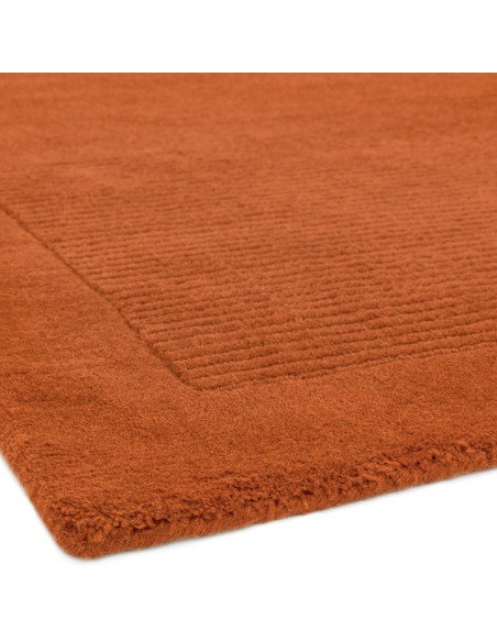 Elevate your space with the York Terracotta rug, a minimalist rug crafted from natural wool featuring an elegant geometric desi