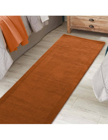 Elevate your space with the York Terracotta rug, a minimalist rug crafted from natural wool featuring an elegant geometric desi