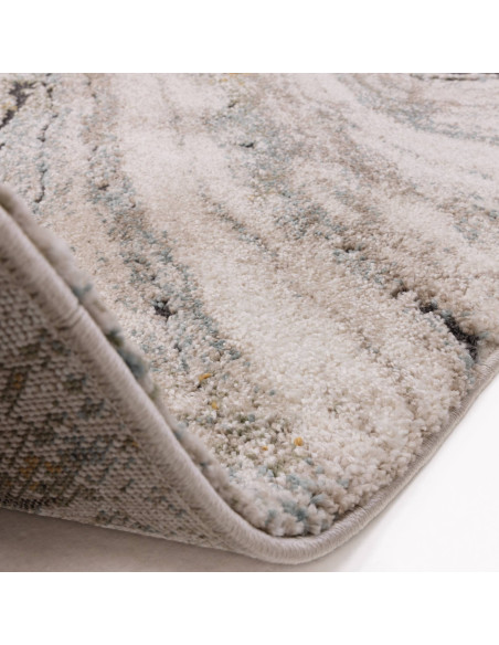Add elegance and comfort to any room with the Mirage Wave Blue shaggy rug, featuring a plush texture and abstract wave design f
