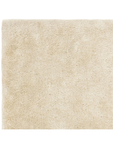 Experience ultimate comfort and timeless style with the Opulence Natural shaggy rug, featuring plush softness and durable, easy