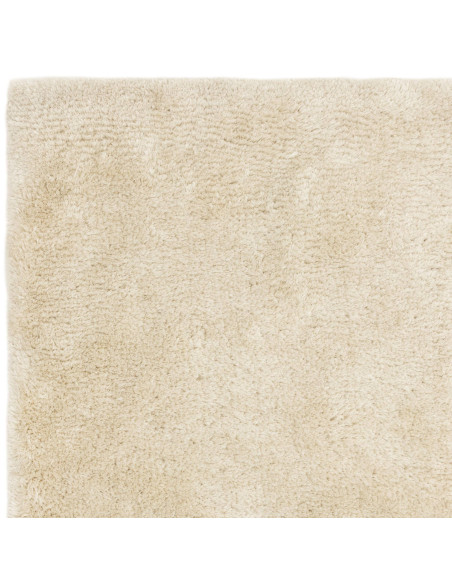 Experience ultimate comfort and timeless style with the Opulence Natural shaggy rug, featuring plush softness and durable, easy