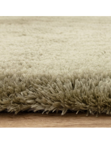 Add warmth and style with the Opulence Sage shaggy rug, featuring a plush hand-tufted texture and durable, easy-care synthetic
