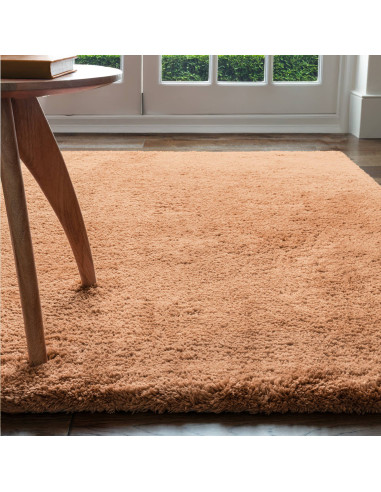 Experience luxurious softness with the Opulence Terra shaggy rug, featuring a warm terra tone and plush texture perfect for any