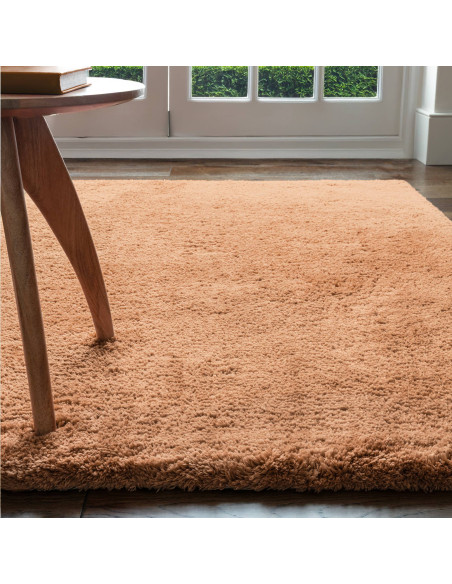 Experience luxurious softness with the Opulence Terra shaggy rug, featuring a warm terra tone and plush texture perfect for any