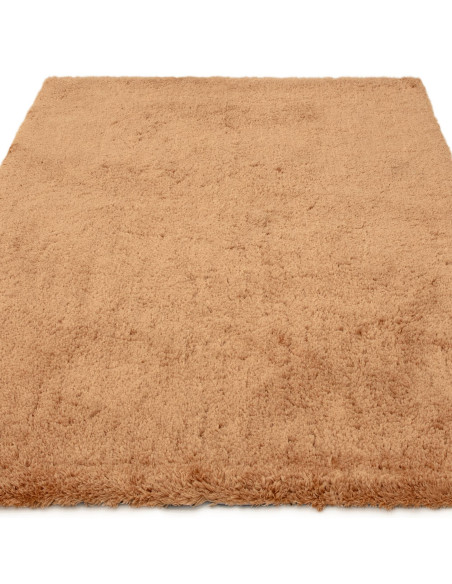 Experience luxurious softness with the Opulence Terra shaggy rug, featuring a warm terra tone and plush texture perfect for any