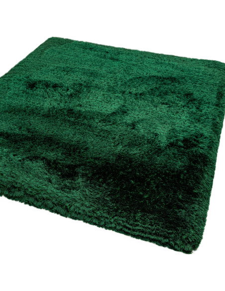 Add luxurious softness and vibrant emerald color to your space with this durable, hand-made plush shaggy rug—perfect for any mo