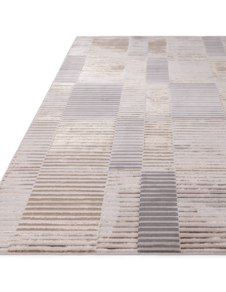 Tappeto Aurora AU14 Ripple: design geometrico e lucido, perfetto per ambienti moderni eleganti. Resistente, facile da pulire e