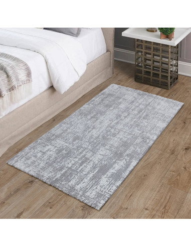 Discover the Kuza Abstract Grey rug, a modern luxury rug with a subtle silk look finish that adds elegance and durability to an