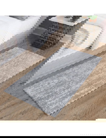 Discover the Kuza Abstract Grey rug, a modern luxury rug with a subtle silk look finish that adds elegance and durability to an