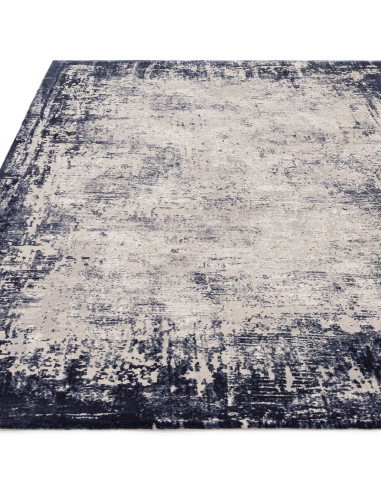 Elevate your space with the Kuza Border Navy rug, a modern luxury rug featuring a subtle lustre and silk look for timeless eleg