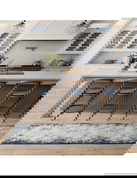 Elevate your space with the Kuza Border Navy rug, a modern luxury rug featuring a subtle lustre and silk look for timeless eleg