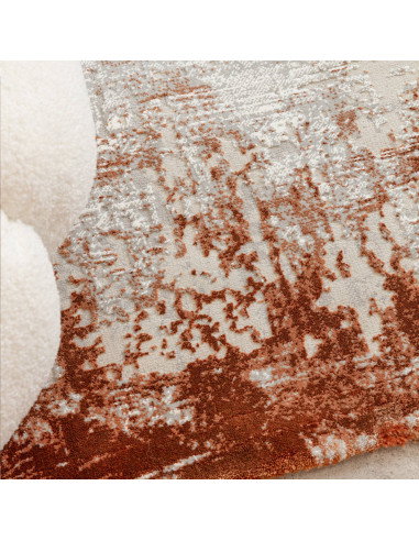 Discover the Kuza Border Terracotta, a modern luxury rug with a shiny, silk look finish that adds elegance and durability to an