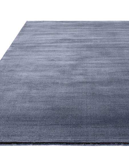 Elevate your space with the Kuza Plain Stripe Navy rug, a modern luxury rug featuring a silk look finish and plush, durable des