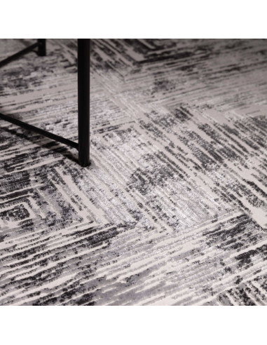 Discover the Kuza Portrait Grey rug, a modern luxury rug with a geometric stripe design and a soft, shiny silk look perfect for