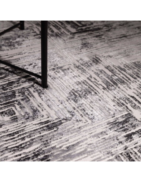Discover the Kuza Portrait Grey rug, a modern luxury rug with a geometric stripe design and a soft, shiny silk look perfect for