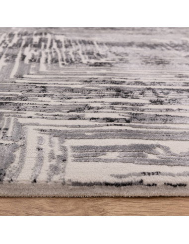 Discover the Kuza Portrait Grey rug, a modern luxury rug with a geometric stripe design and a soft, shiny silk look perfect for