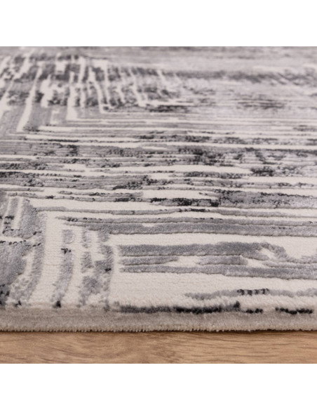 Discover the Kuza Portrait Grey rug, a modern luxury rug with a geometric stripe design and a soft, shiny silk look perfect for