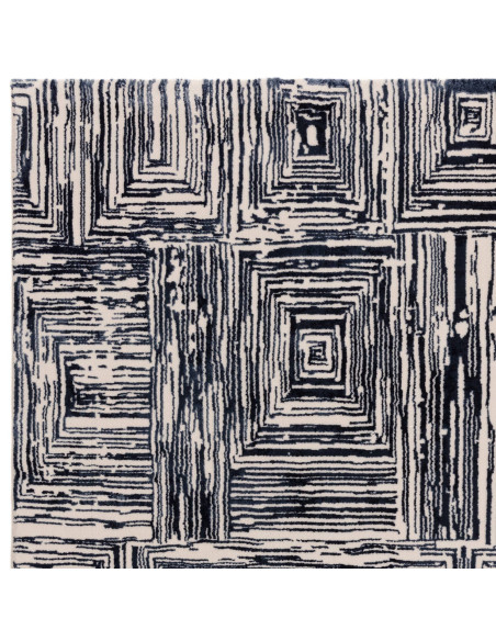 Elevate your space with the Kuza Portrait Navy modern luxury rug, featuring a lustrous geometric design and soft, durable synth